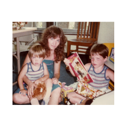 Randy (on the right) and his biological brother, Wesley, together with their biological mother on their adoption day.
