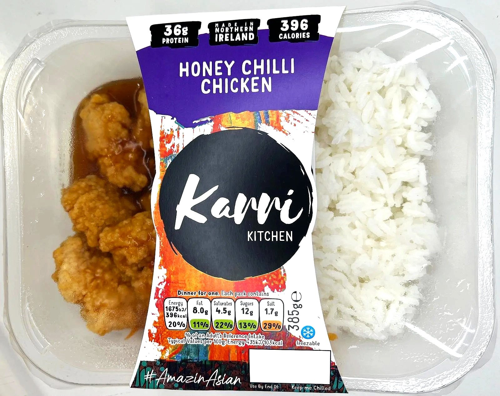 Pre-packaged meal of honey chili chicken with rice, containing fried chicken pieces in sauce, and white rice in a plastic container, labeled with nutritional information and branding.