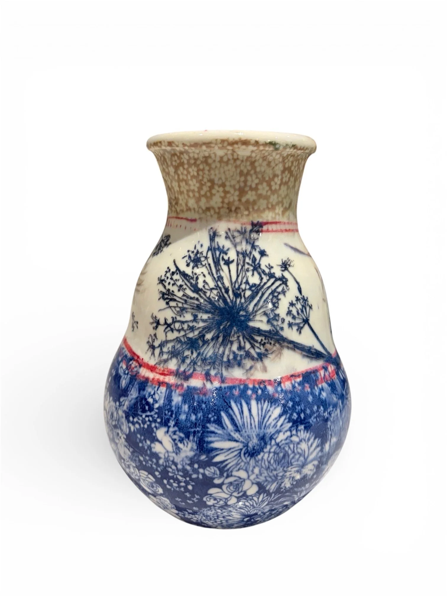 A decorative ceramic vase with a floral pattern featuring blue and white flowers and a beige top section.