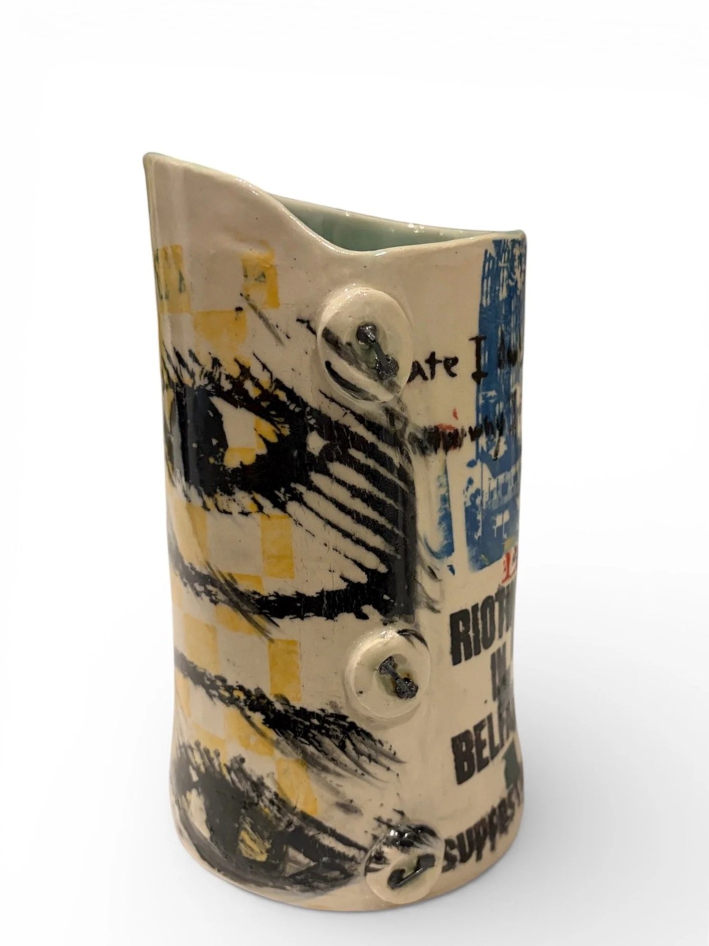 Ceramic sculpture with abstract artwork, text, and three visible screws on the front.