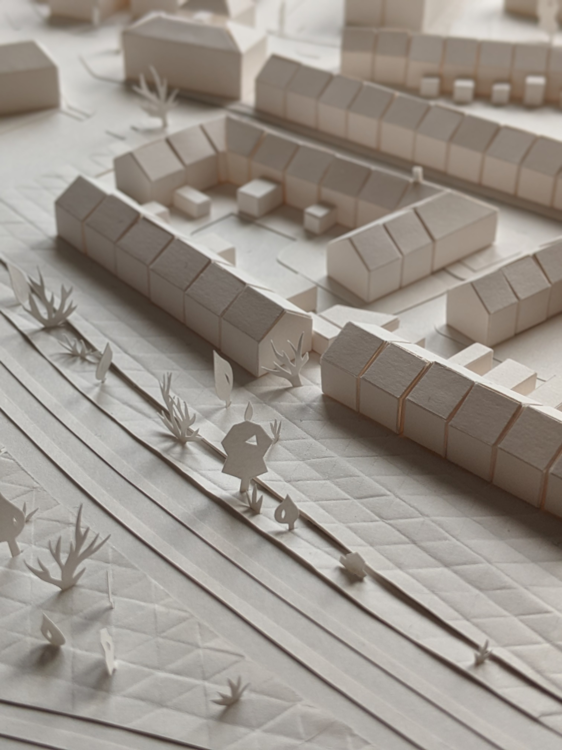 Tiny terraced houses modelled in white paper