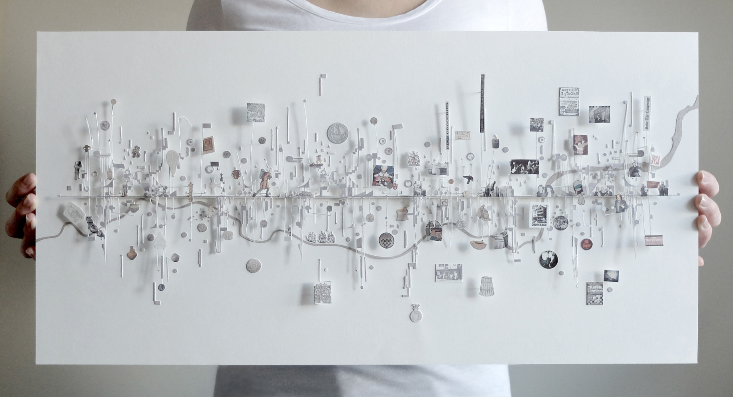 Intricately detailed abstract timeline being held up by a person