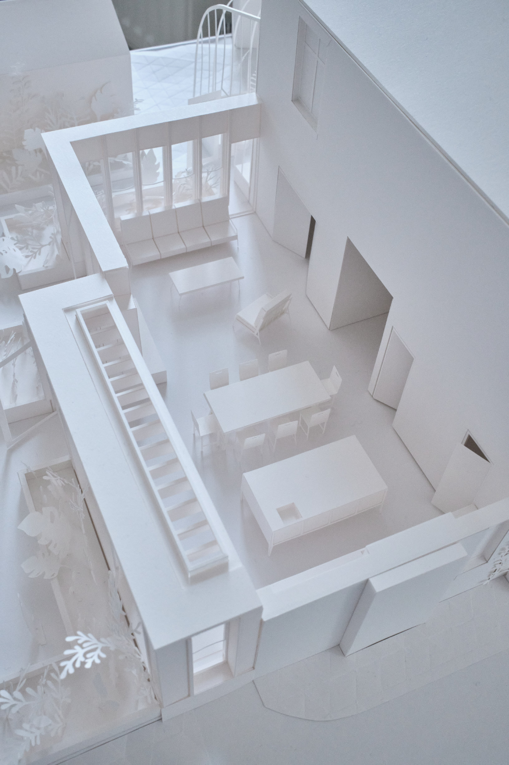 Model with its roof removed to reveal the interior and tiny modelled furniture inside