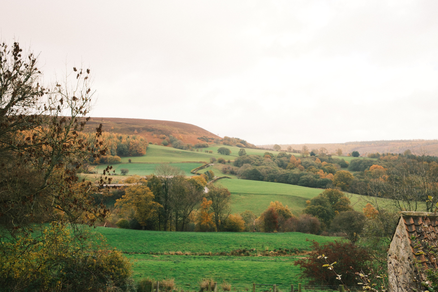 Rolling yorkshire countryside views and part of old stone barn
