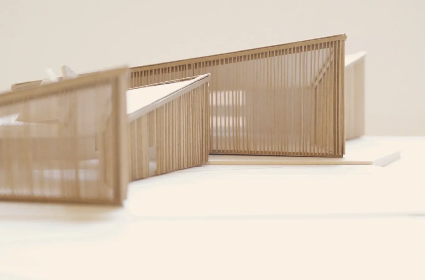 Concept model of a series of triangular shaped buildings with vertical timber cladding 