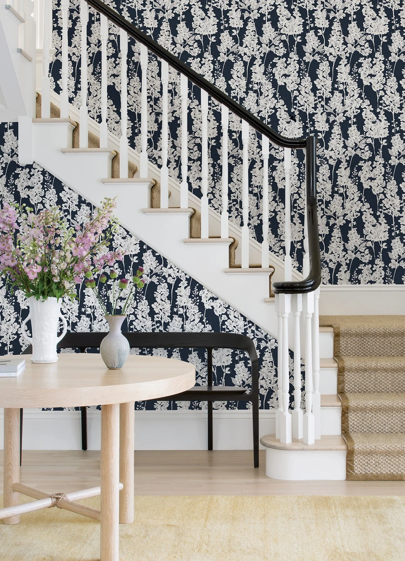 Black and white floral wallpaper in an entryway