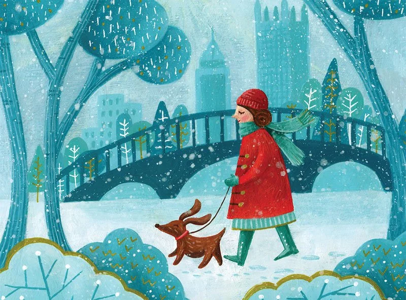 woman walking her dog in a park in winter