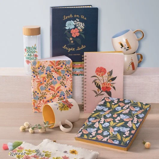 collection of floral decorated stationery and mugs