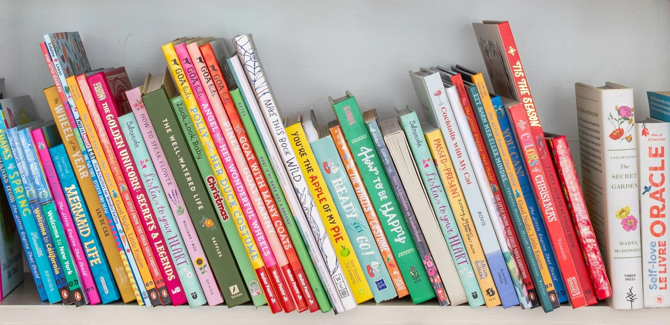 collection of children's books angled sitting on a shelf