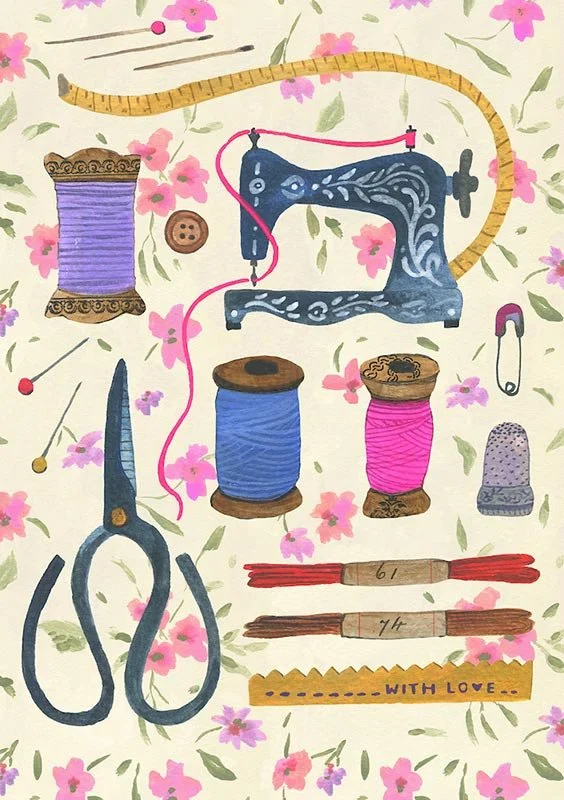 sewing notions and a sewing machine on a soft floral background