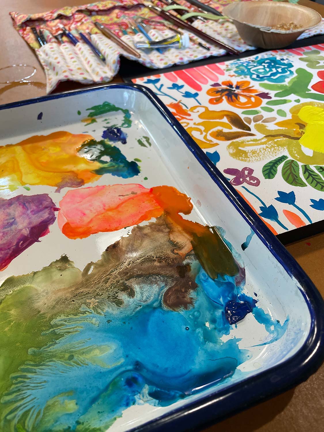 messy paint palette and sketchbook