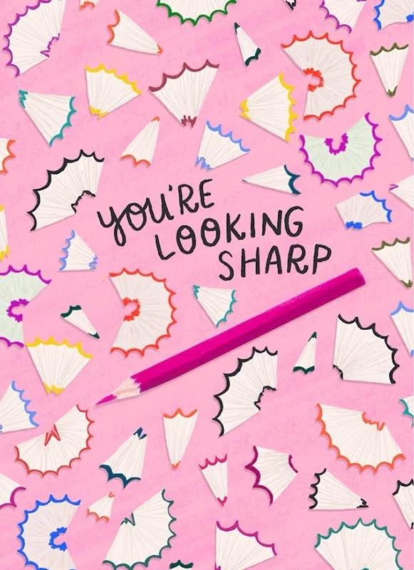 colored pencil shavings on a pink background with the words "you're looking sharp"