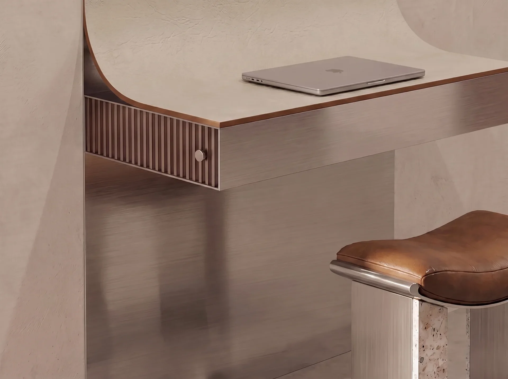 A closed silver laptop placed on a beige, textured surface near a corner of a desk. The desk has a curved edge with wood trim and vertical slats on the side. There is a wooden chair with a padded, brown leather seat visible in the corner of the image