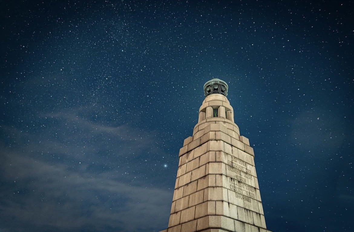Dundee Law under a starry night sky with clouds, photographed by Kaelyn Robertson Sakura Property Collective, estate agents in Dundee & St Andrews.
