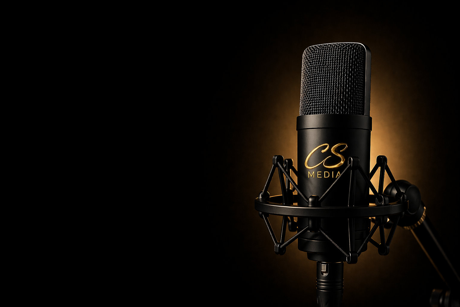 CS Media microphone on a dark background with warm studio lighting.