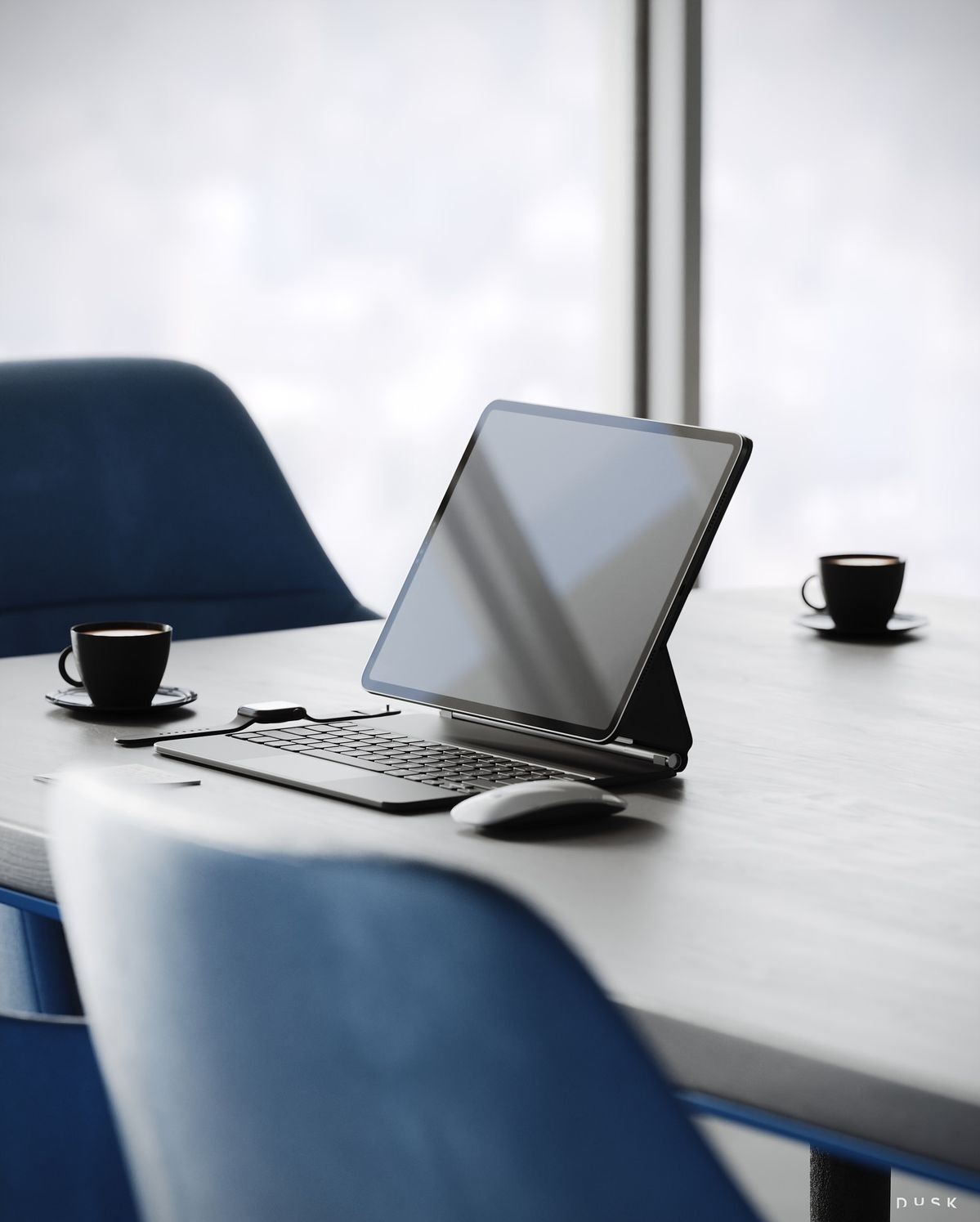 A modern office conference table with a tablet standing on a keyboard, a mouse, two black coffee cups on saucers, and blue chairs around it, with large windows in the background.