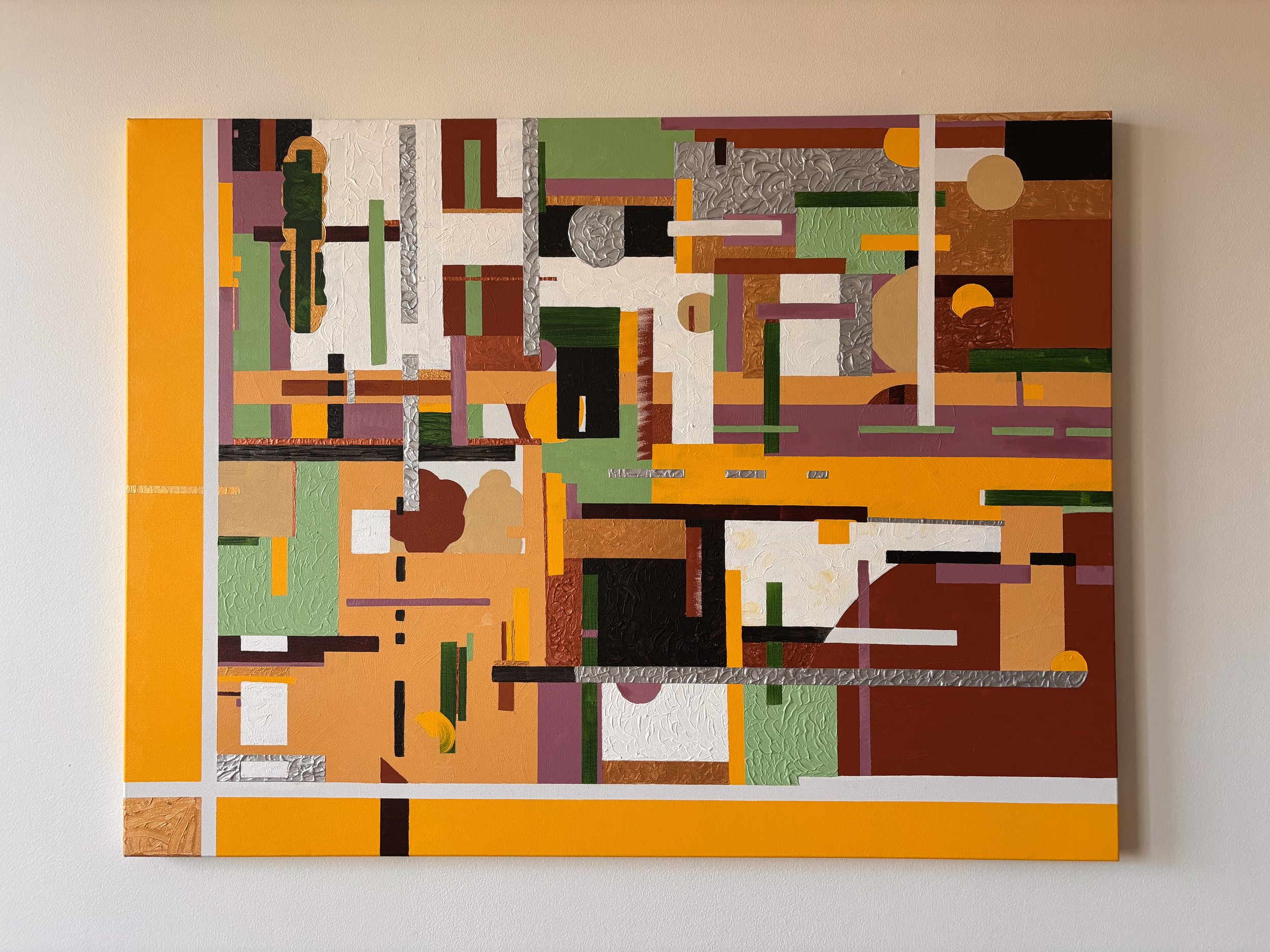 Abstract geometric painting with various shapes and colors, including orange, green, white, black, purple, and brown, on a wall.
