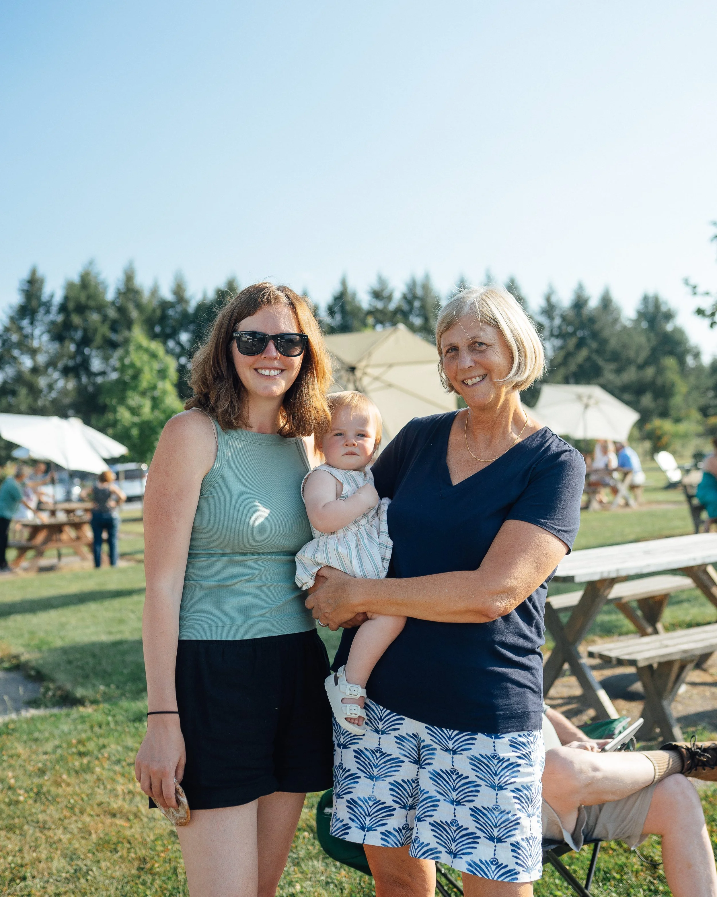 three people smiling for camera at fox run vineyards