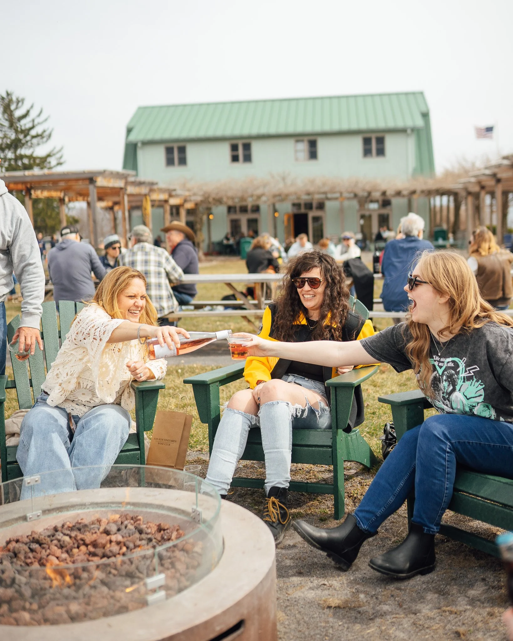 Fox Run Vineyards guests pouring wine