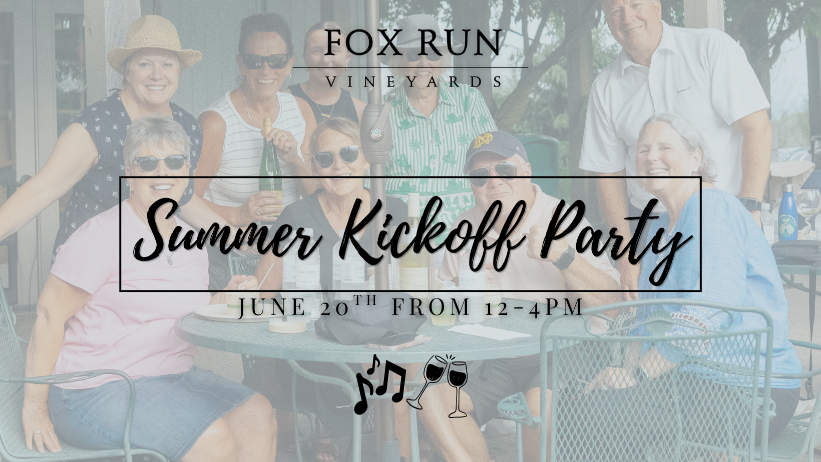 People sitting at a table with wine at fox run vineyards