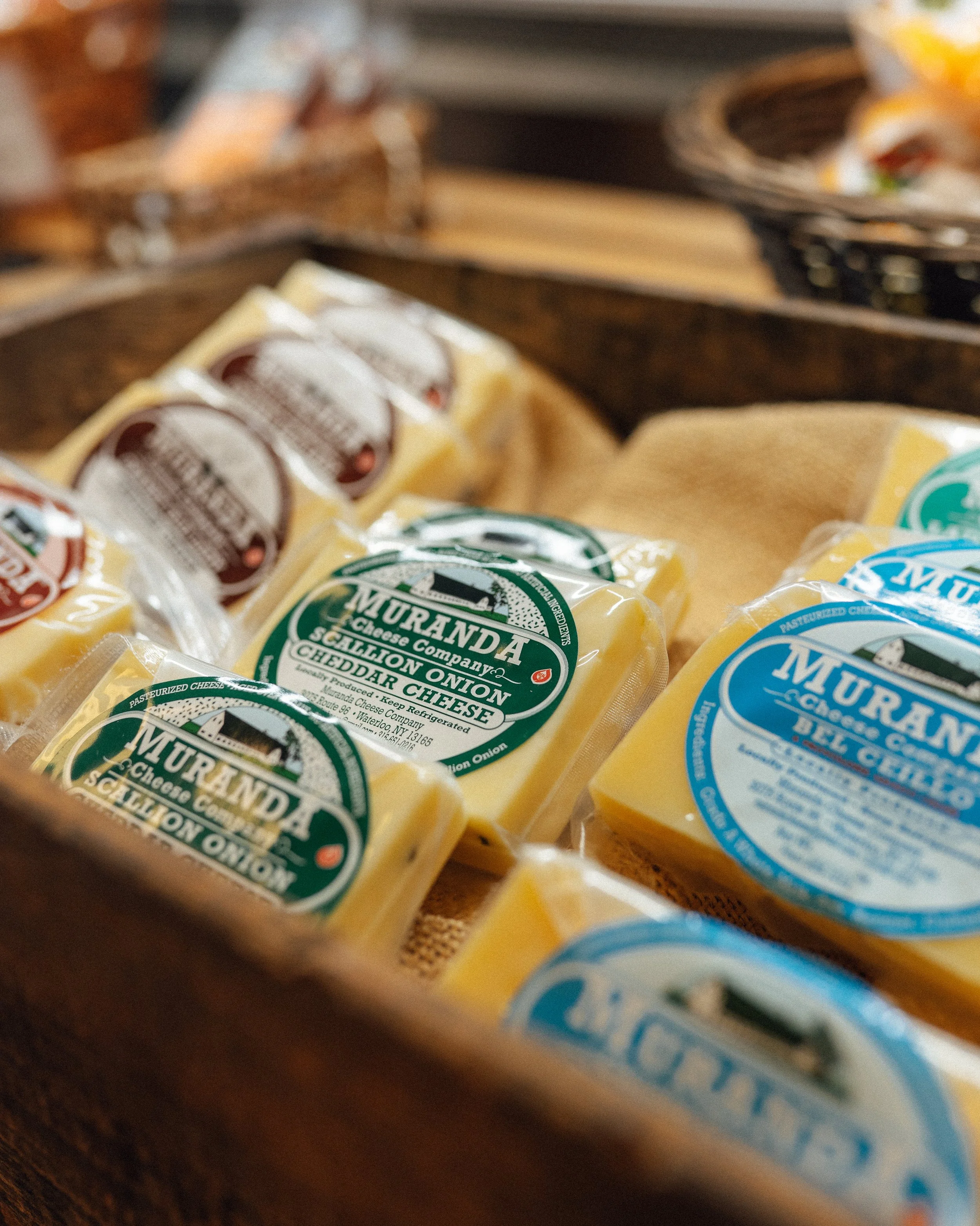 cheese sitting in a deli case