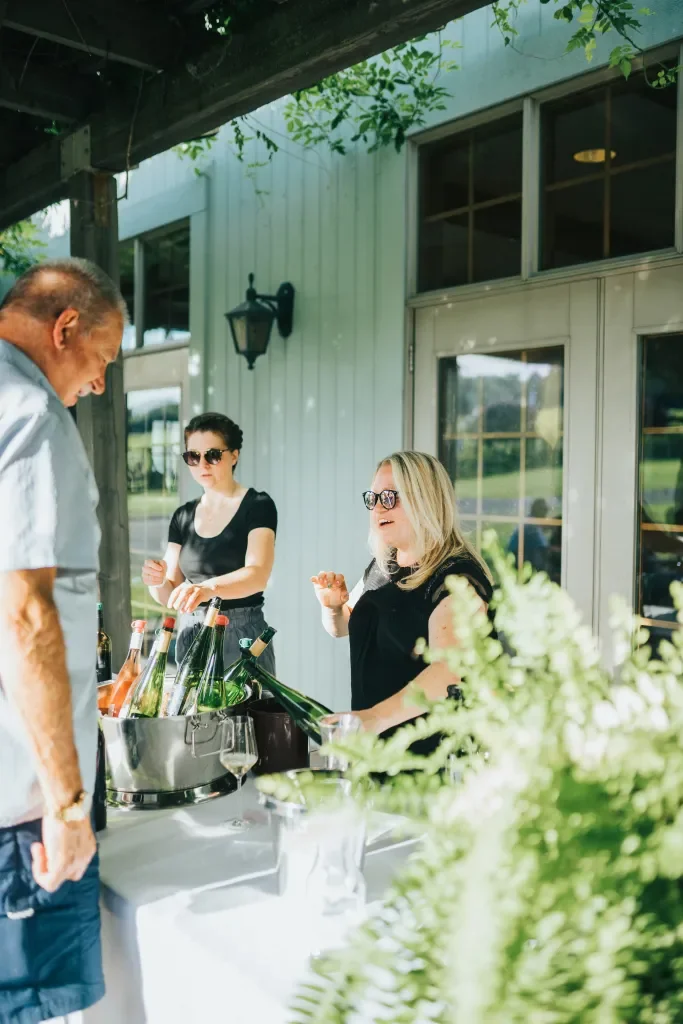 guest sampling wine at wine club event