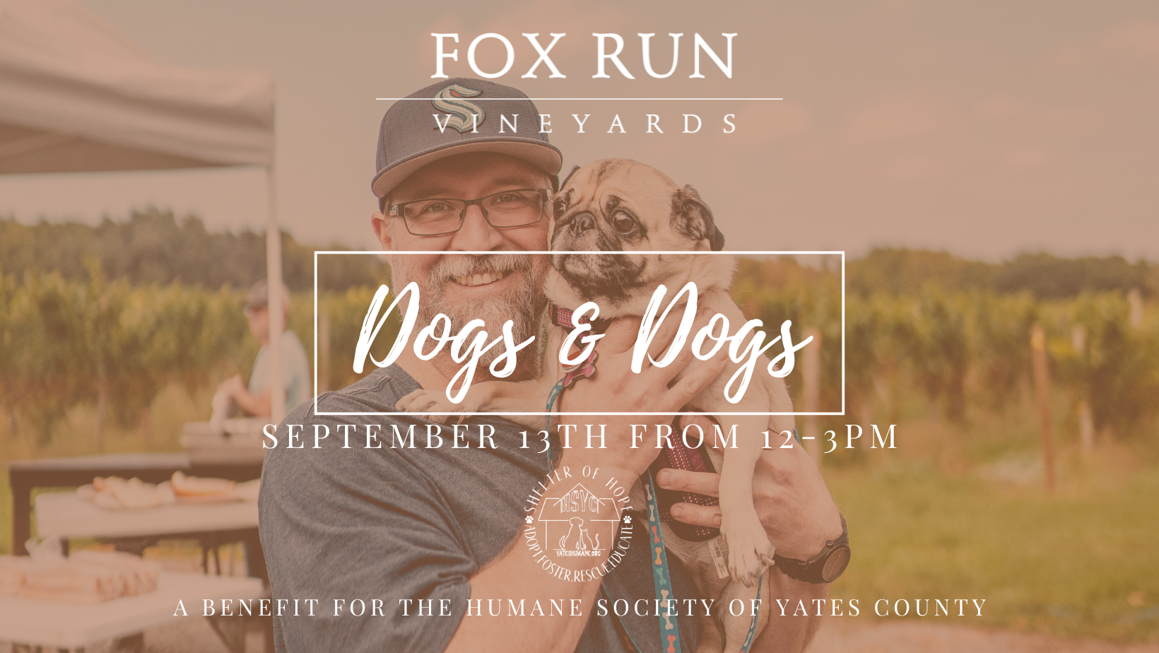 A person holding their dog and smiling for a picture