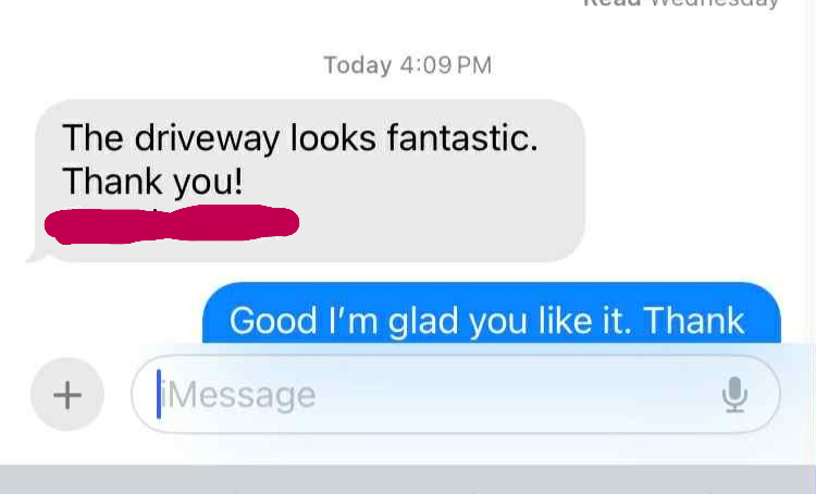 Text message conversation about a driveway, with the first message saying "The driveway looks fantastic. Thank you!" and the reply saying "Good I'm glad you like it. Thank".