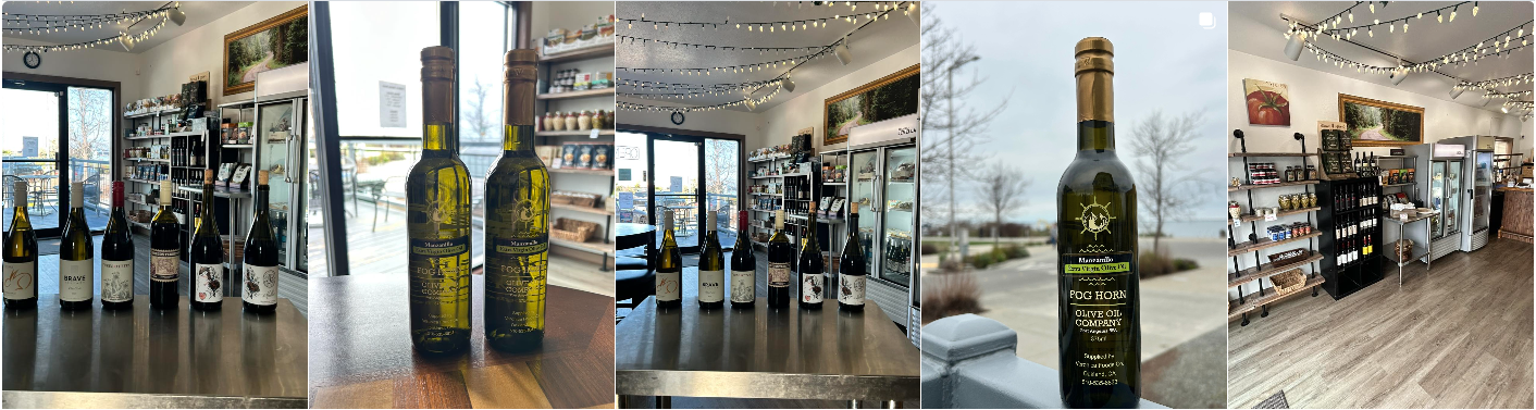 Various Fog Horn Tasting Room olive oils and wines displayed on top of a table