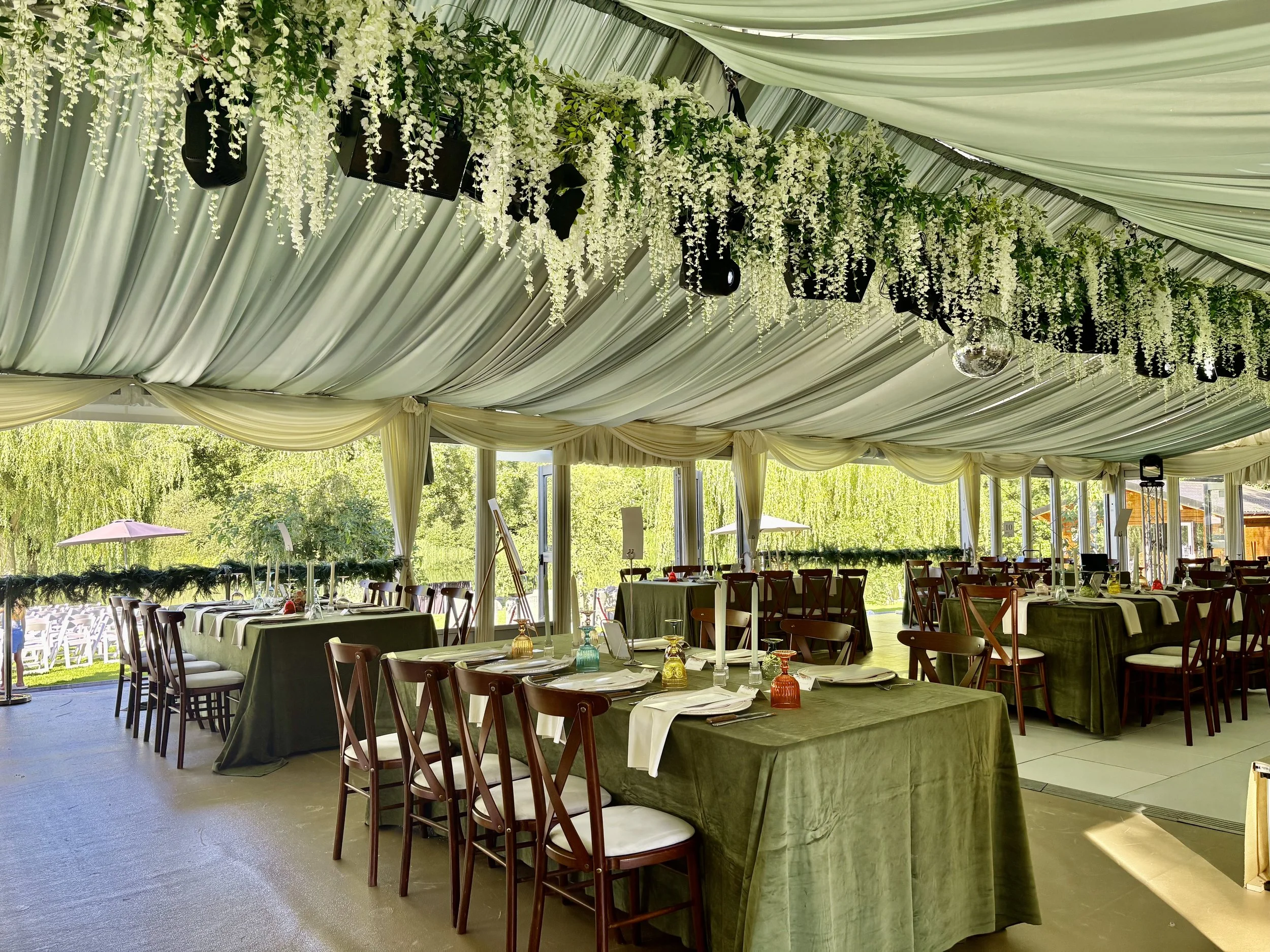 Wisteria draped roof in sage green drapes