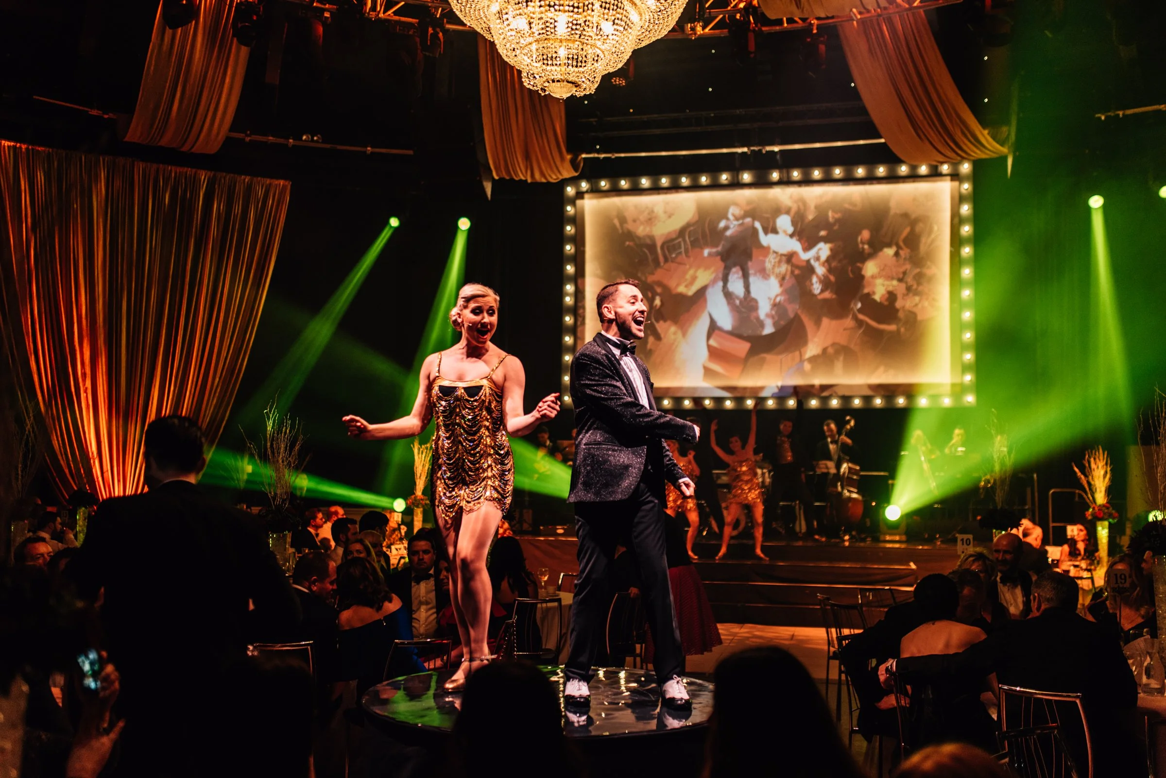 A Gatsby party with gold fabric draping to enhance a New Years Eve Party