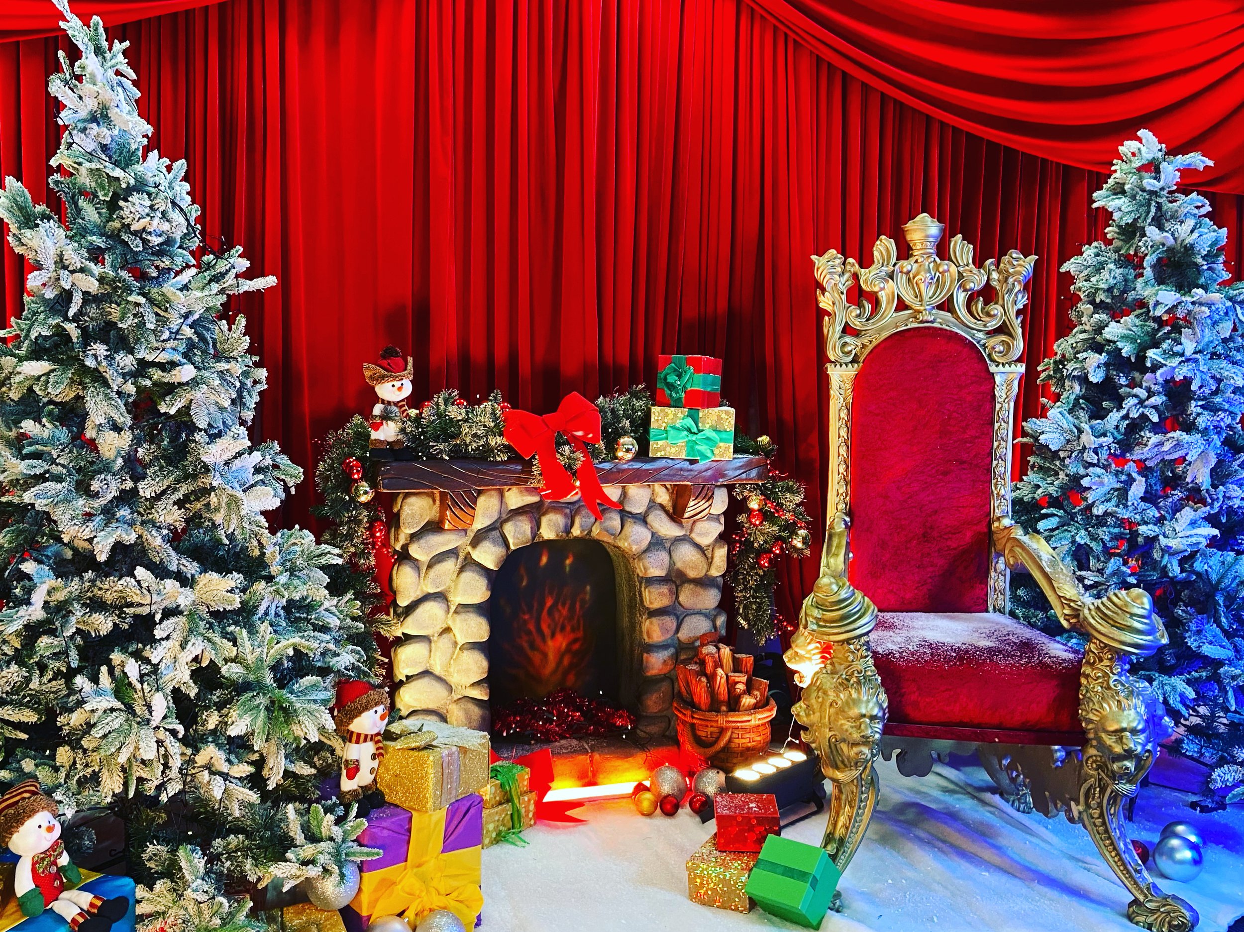 This image captures a luxurious Christmas corridor styled like a festive stage set.