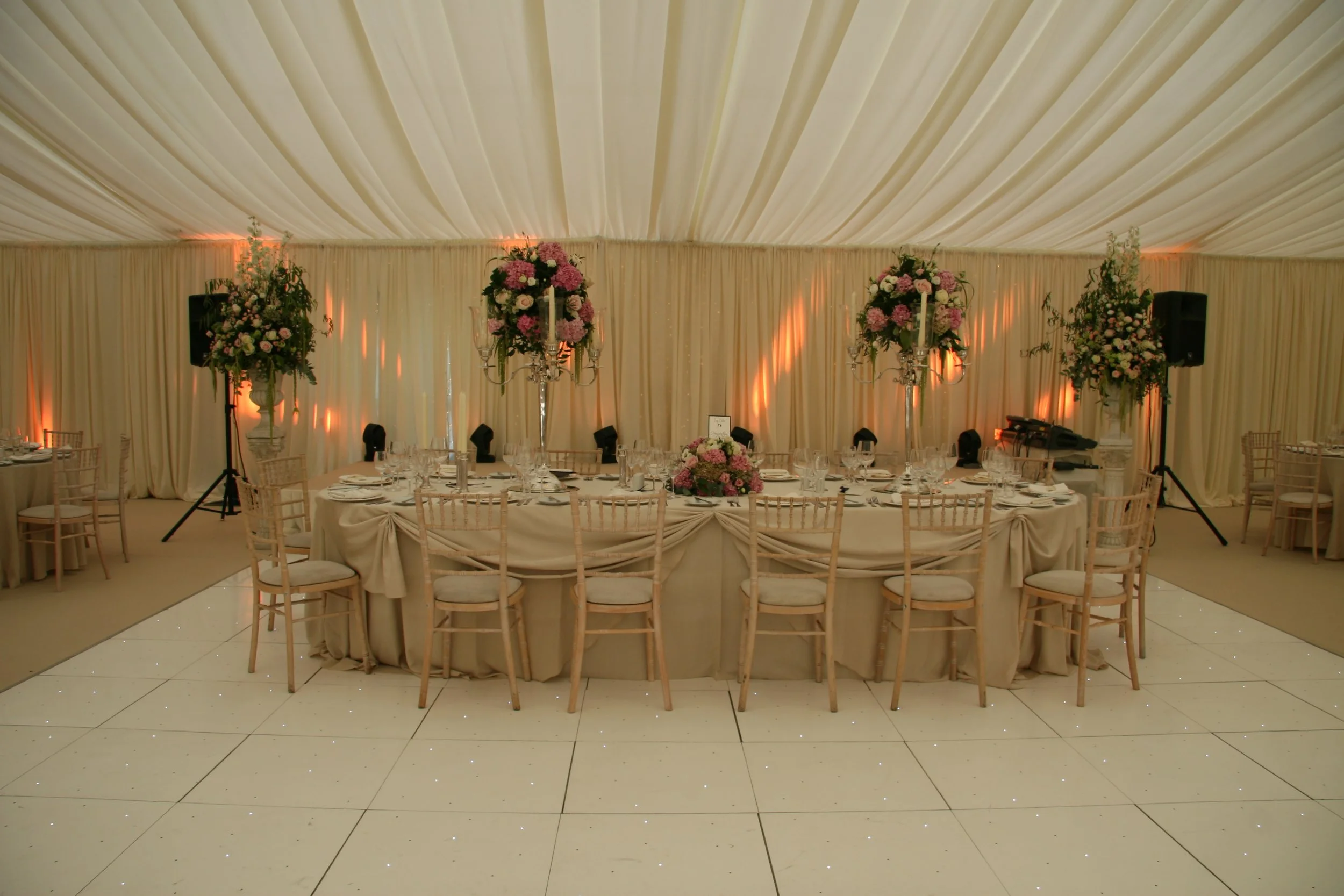 Ivory Draped marquee roof with ivory top table