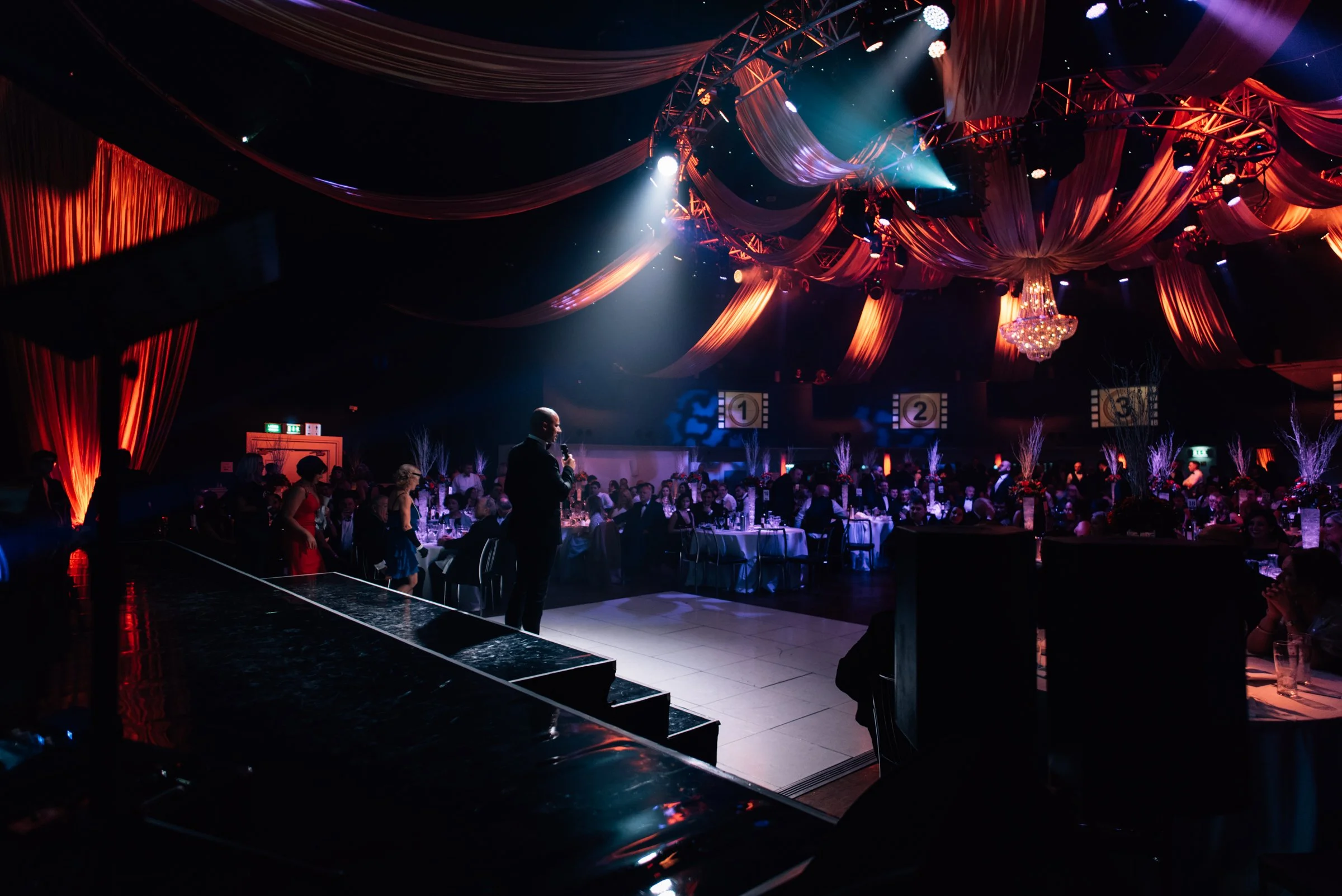 A Gatsby party with gold fabric draping to enhance a New Years Eve Party