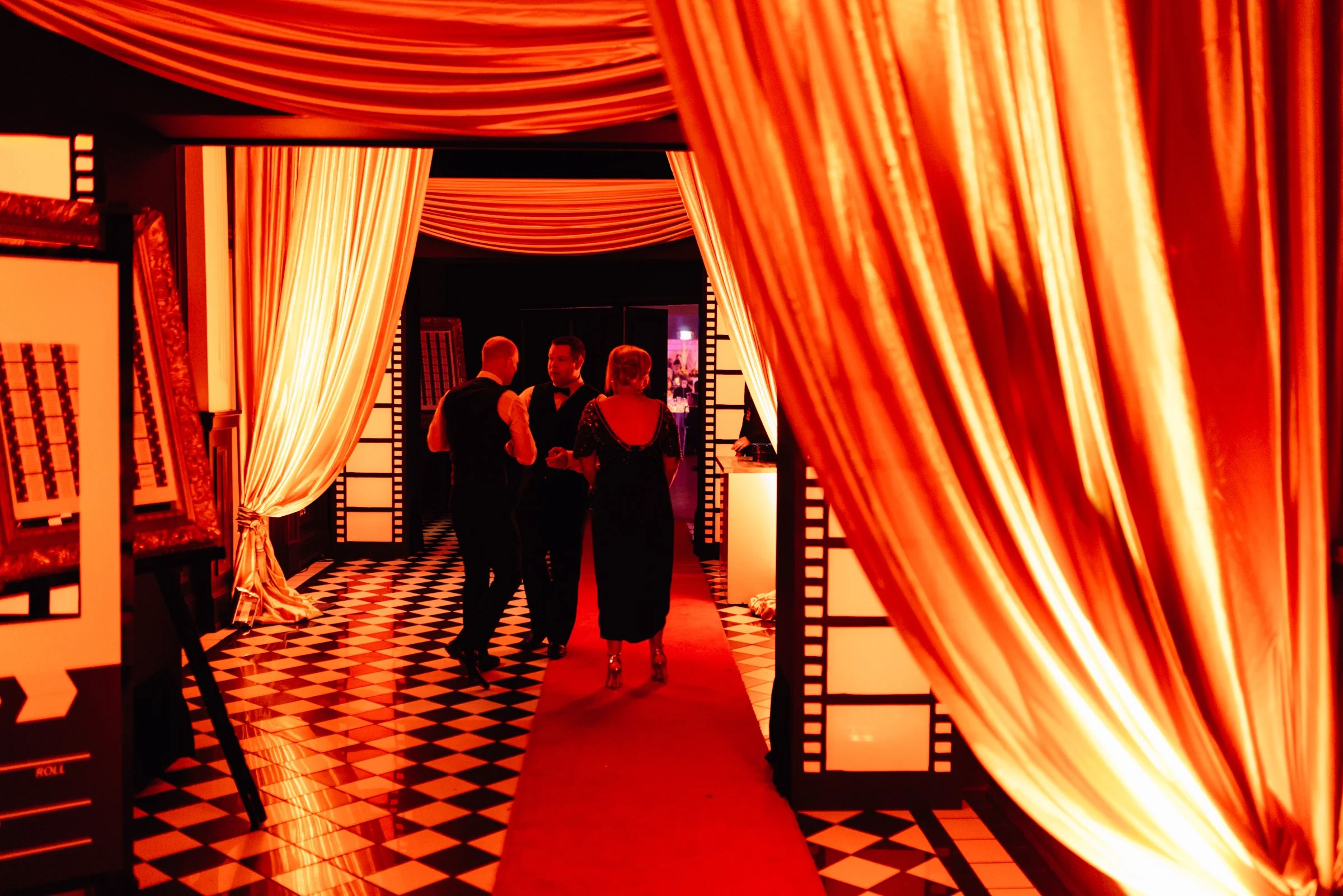A Gatsby party with gold fabric draping to enhance a New Years Eve Party