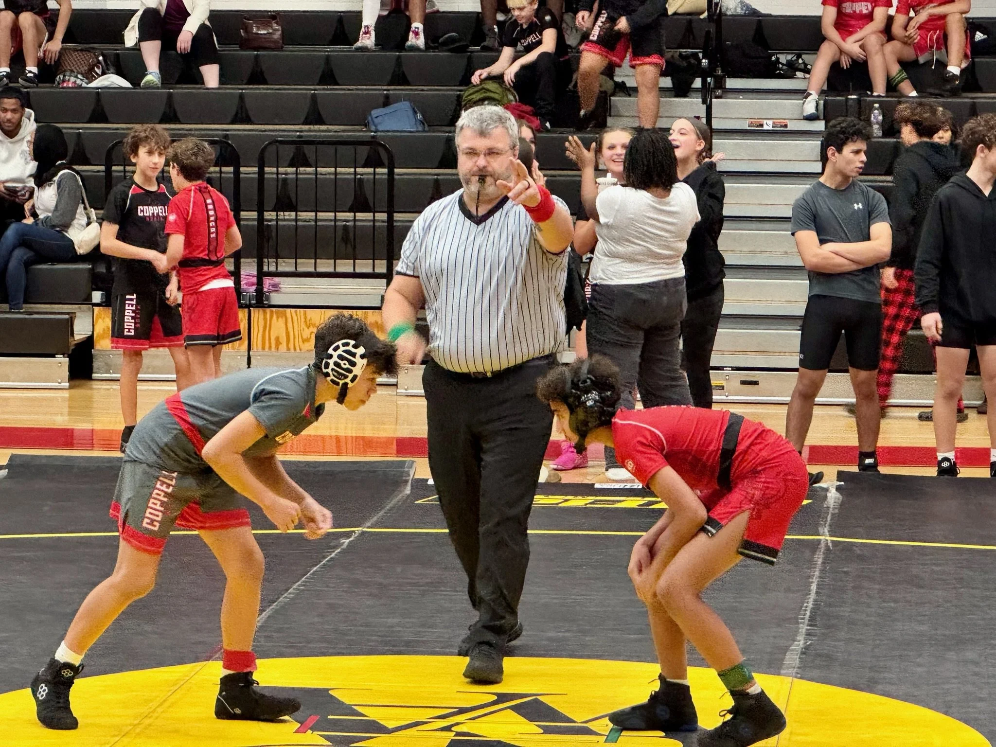 Windham son participating in wrestling match for Coppell ISD.