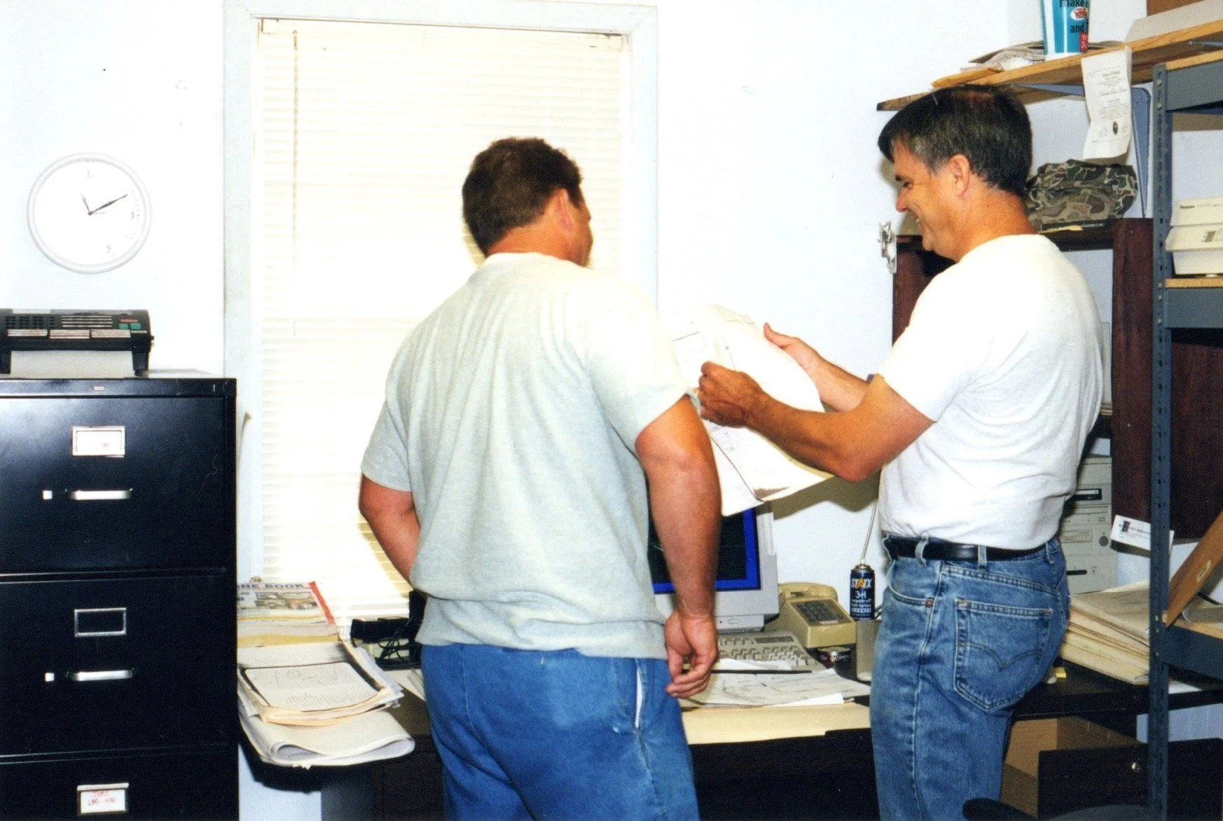 Alan Platt, Crawfordville office consulting with Bill Davis.