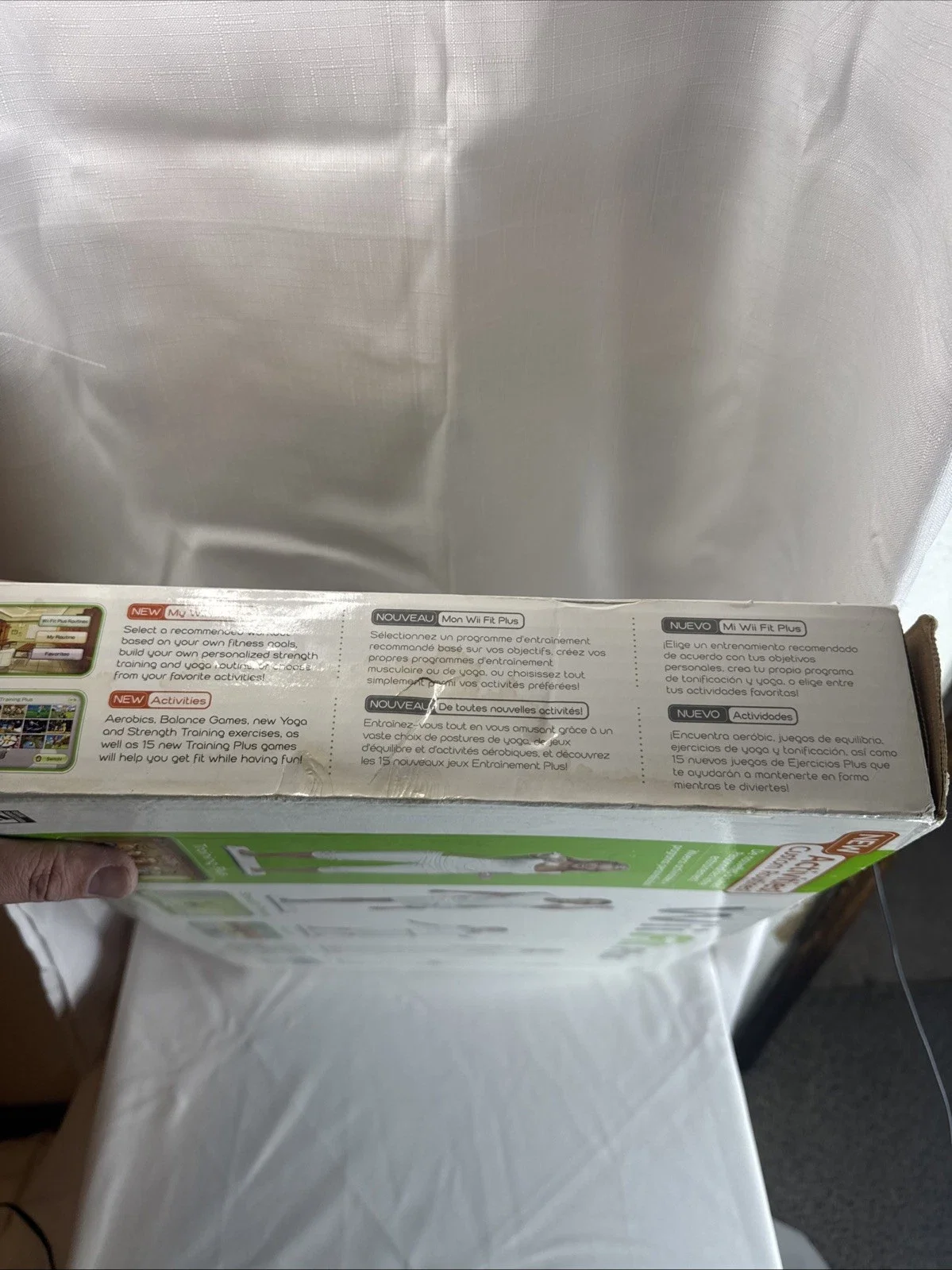 The Wii Fit Plus Bundle includes the Nintendo Wii console, along with the game "Wii Fit Plus" published by Nintendo Games.