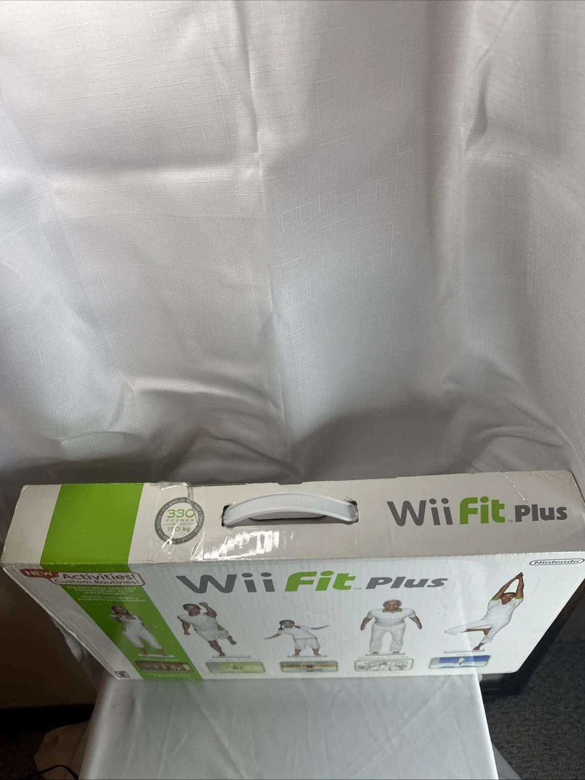 The Wii Fit Plus Bundle includes the Nintendo Wii console, along with the game "Wii Fit Plus" published by Nintendo Games.