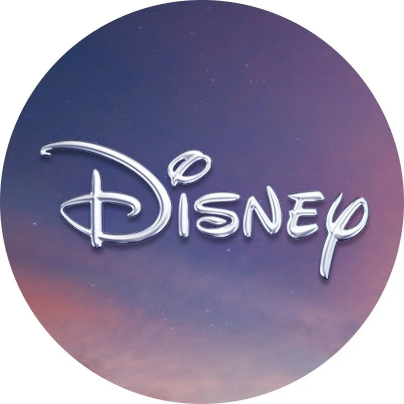 Disney logo with a whimsical font against a gradient sky background.