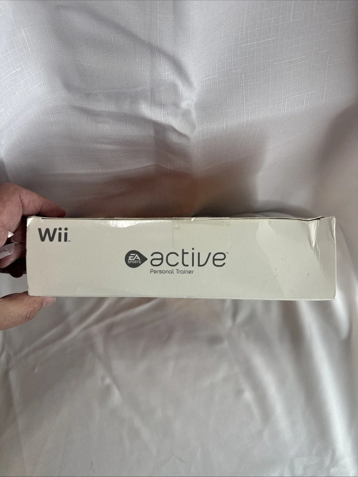 The product is a new open box copy of EA Sports Active for the Nintendo Wii console. Published by Electronic Arts, this game falls under the sub-genre of boxing and carries an E-Everyone rating.