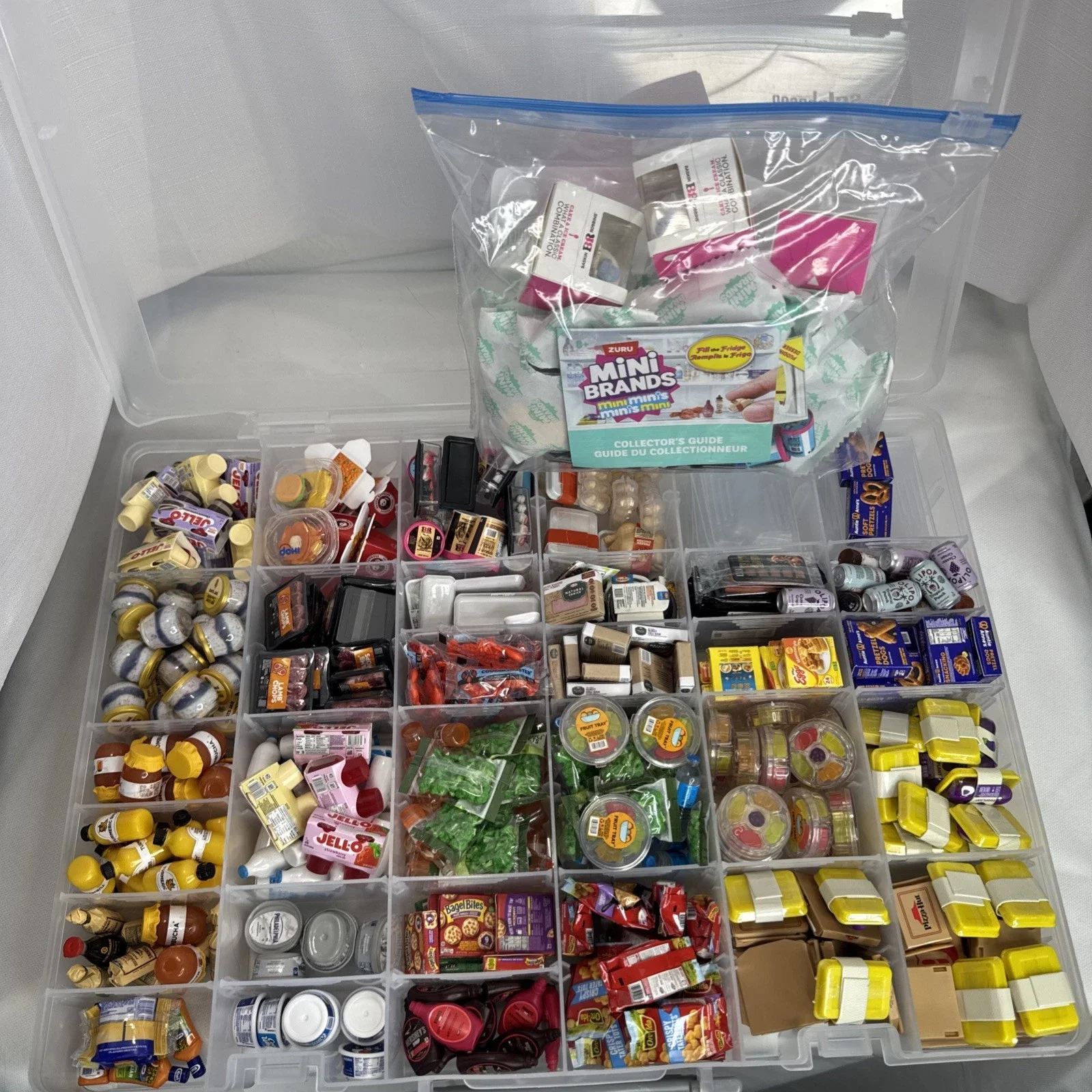 ZURU Mini Brands fill the fridge series 1  set packaging with branding surrounded by the various miniatures that are part of this collectible set