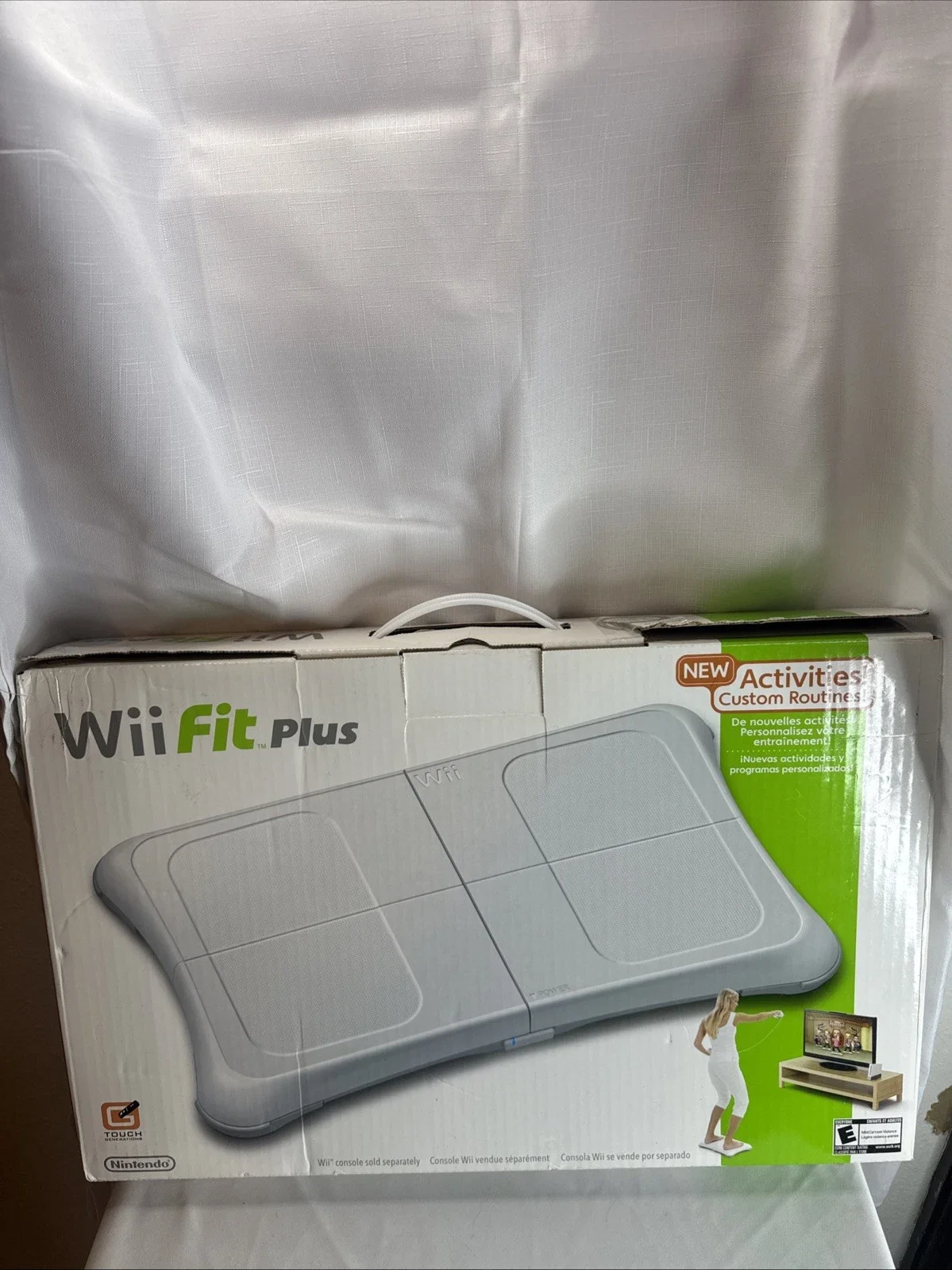 The Wii Fit Plus Bundle includes the Nintendo Wii console, along with the game "Wii Fit Plus" published by Nintendo Games.
