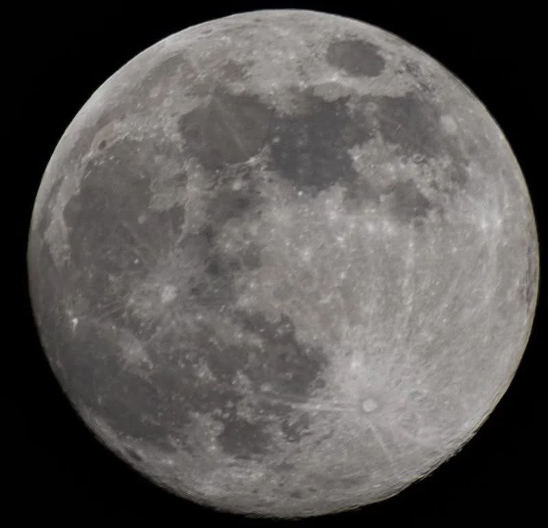 A clear, detailed photograph of the full moon against a black night sky.