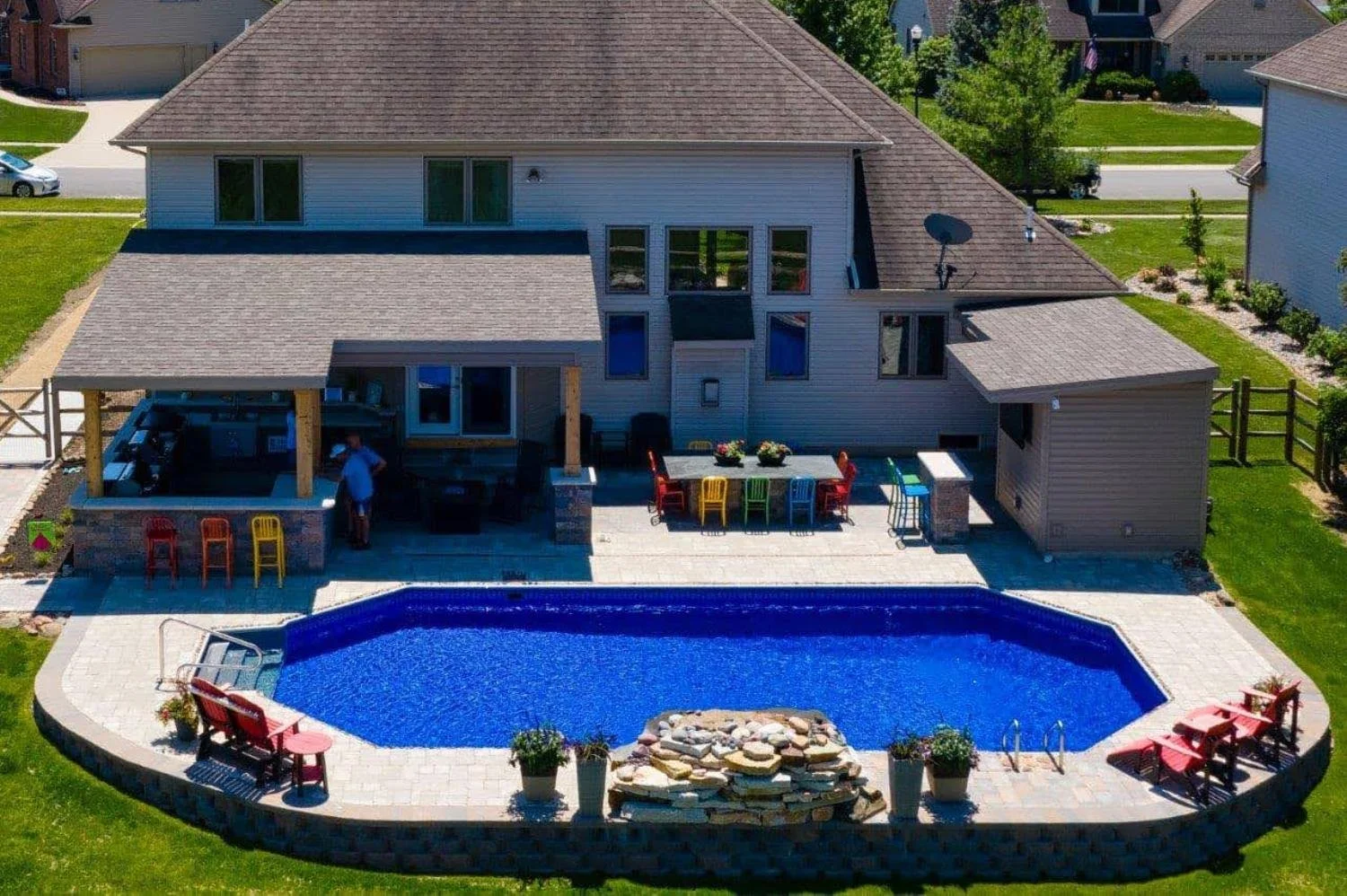 Outdoor living space with swimming pool by Luck Lagoons