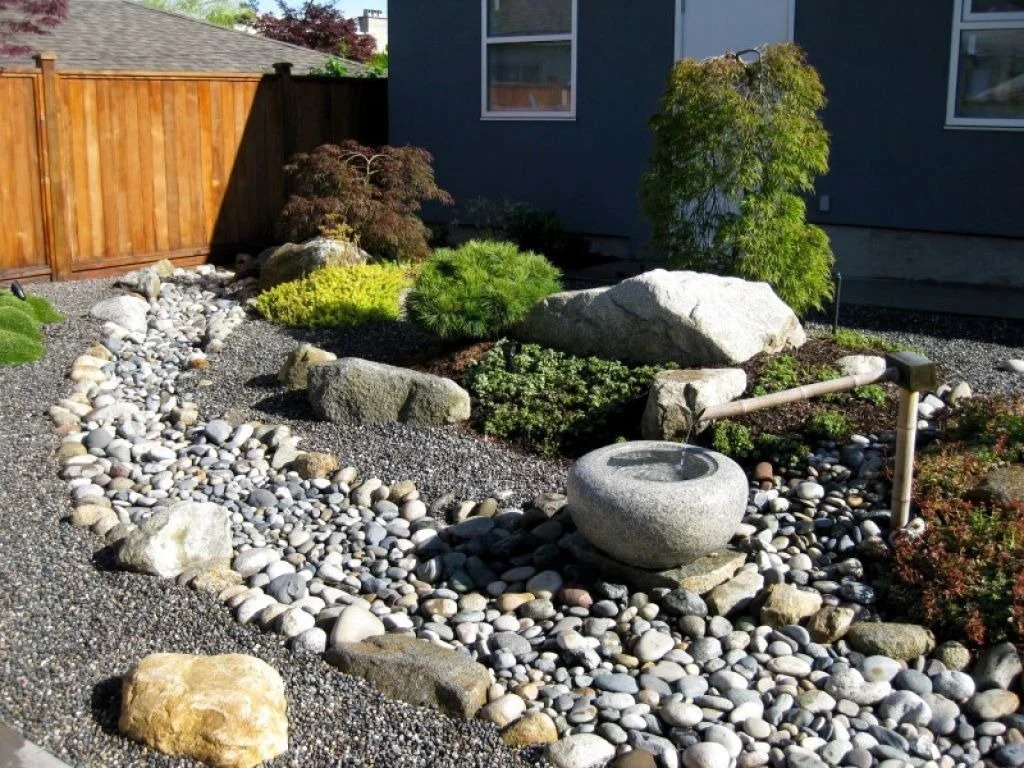Rock landscaping design by Luck Lagoons Landscaping