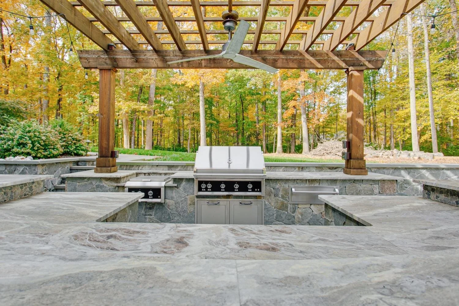 A custom outdoor kitchen with a pergola