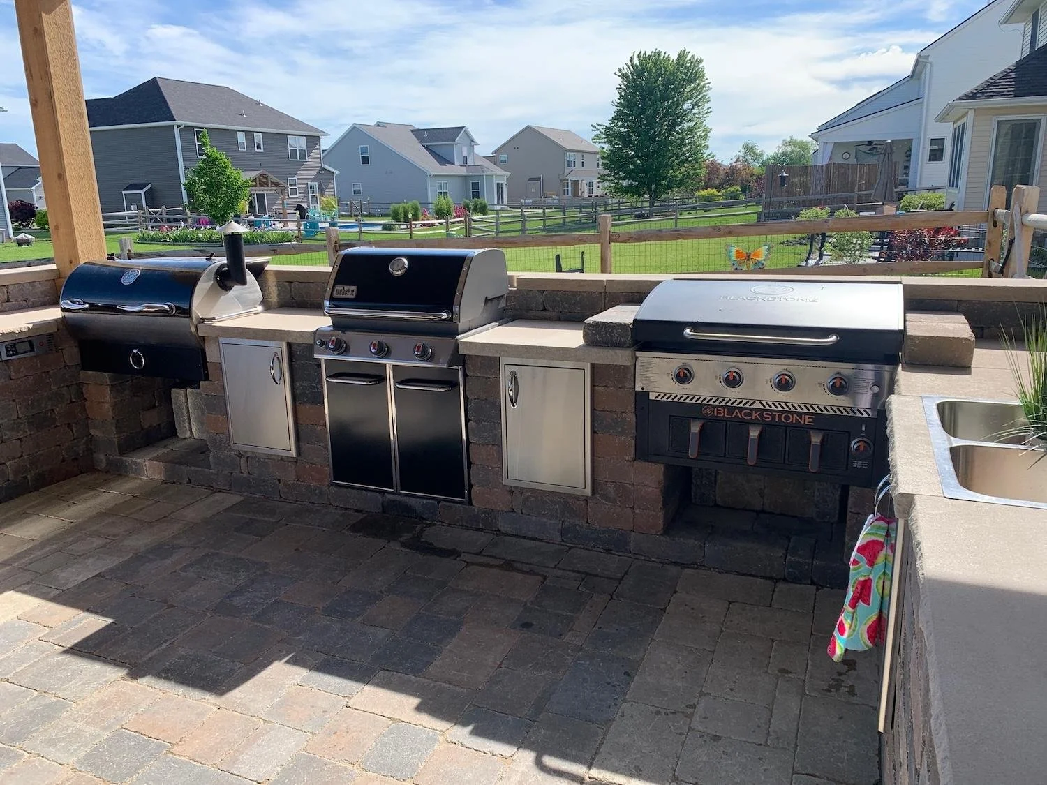 Custom outdoor kitchen by Luck Lagoons luxury backyard