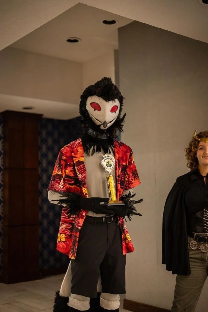 Cam Mashak (me) receiving award for my cosplay of Stolas from Helluva Boss