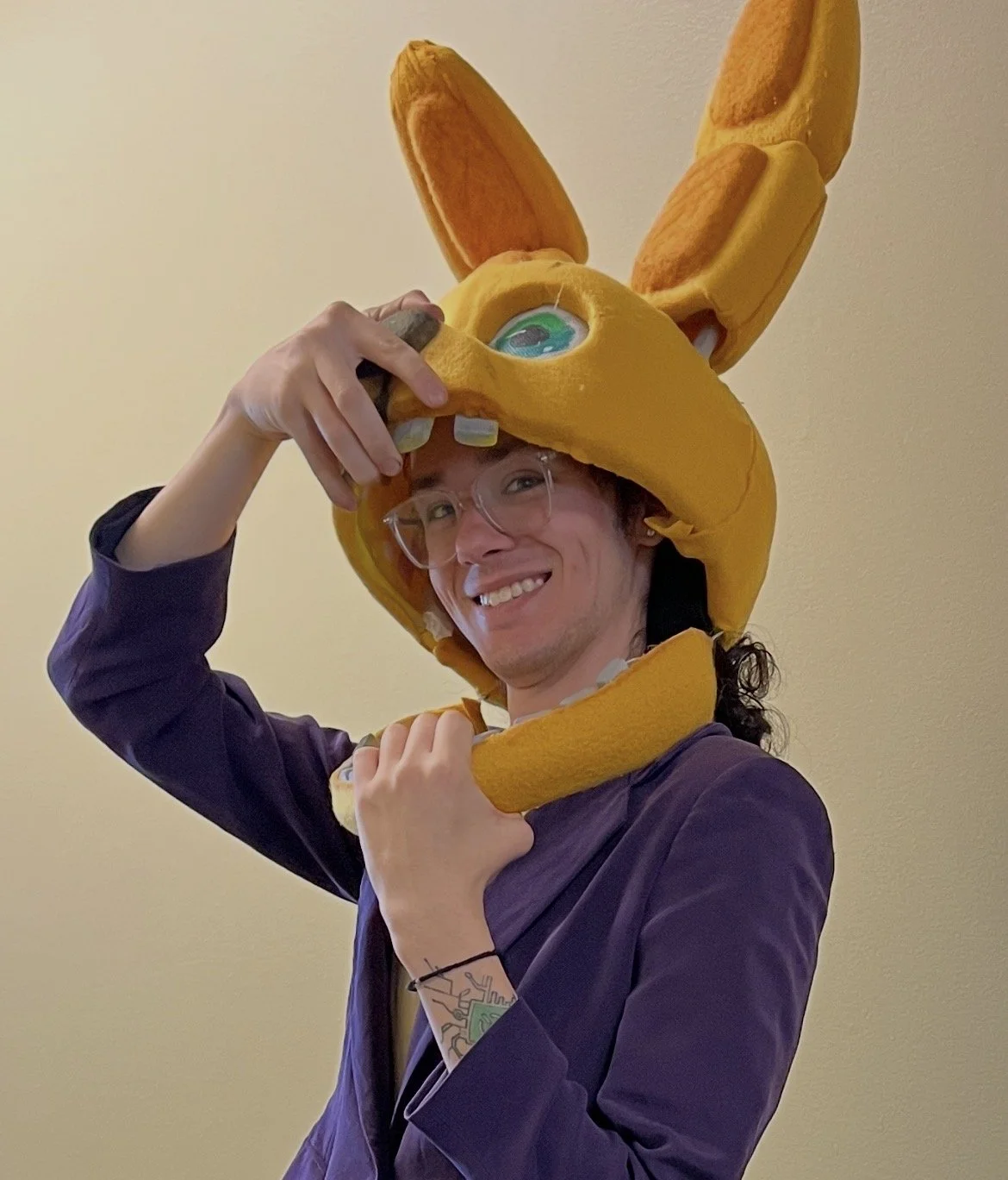 Website owner, Cam, wearing a FNAF Spring Bonnie mask.